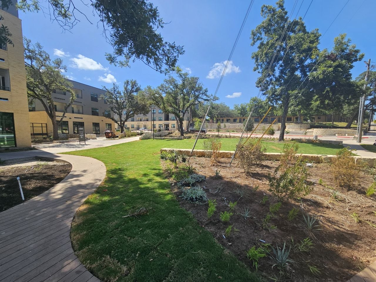 Landscaped courtyard and walking paths outside the WOW Heritage Center