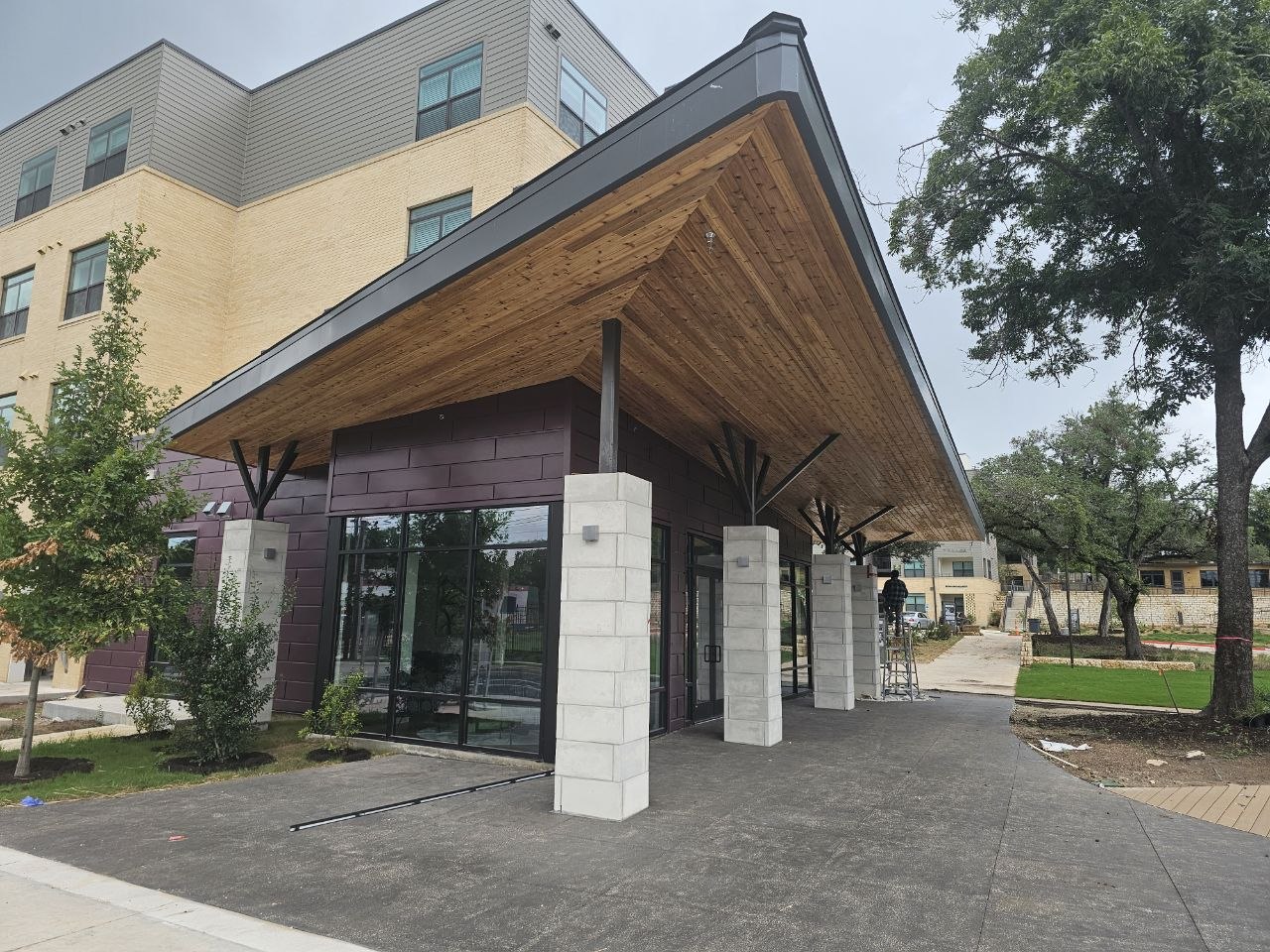 Covered wood canopy and glass storefront at the WOW Heritage Center