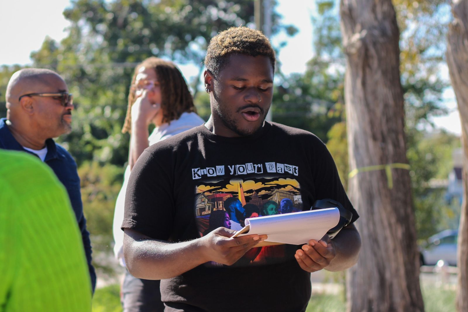 A young presenter reads from notes during a WOW Heritage Center community event